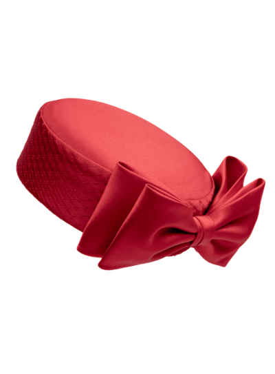 Red Aveline silk pillbox with tight veiling around circumference and tailored silk bow