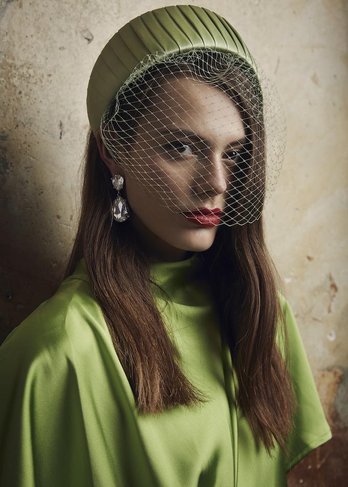 Green pleated silk headpiece with veil