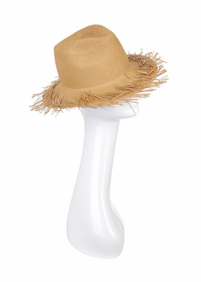 Tan straw Panama hat with frayed brim on mannequin