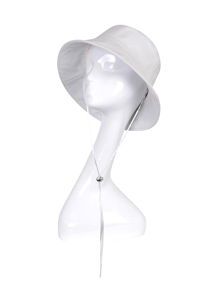 White leather bucket hat with crystal chain on mannequin