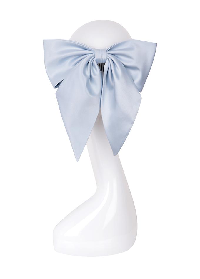 Pale blue silk bow hair accessory on mannequin