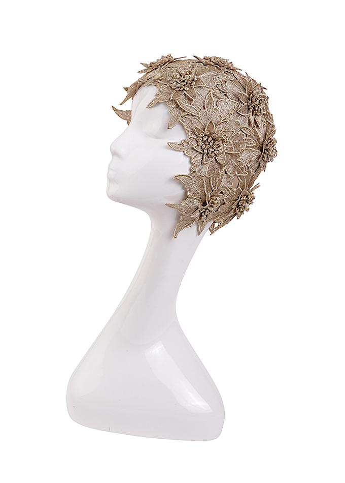Gold leaf bathing hat on mannequin
