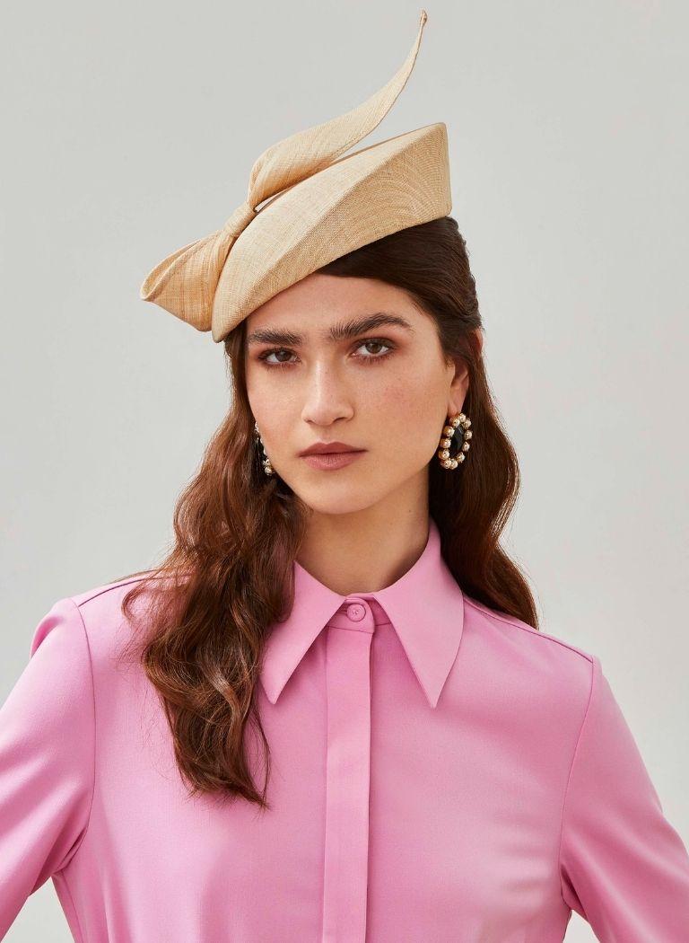 Alnwick disk hat from Emily London luxury headwear collection worn by model wearing pink