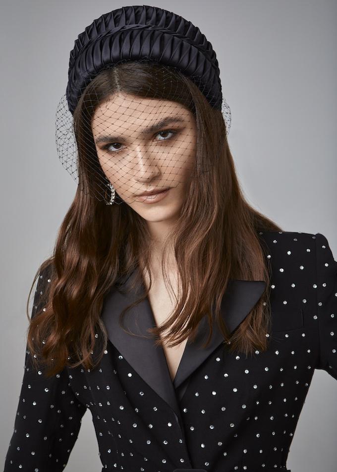 Black smocked silk hatband with removable veil on model