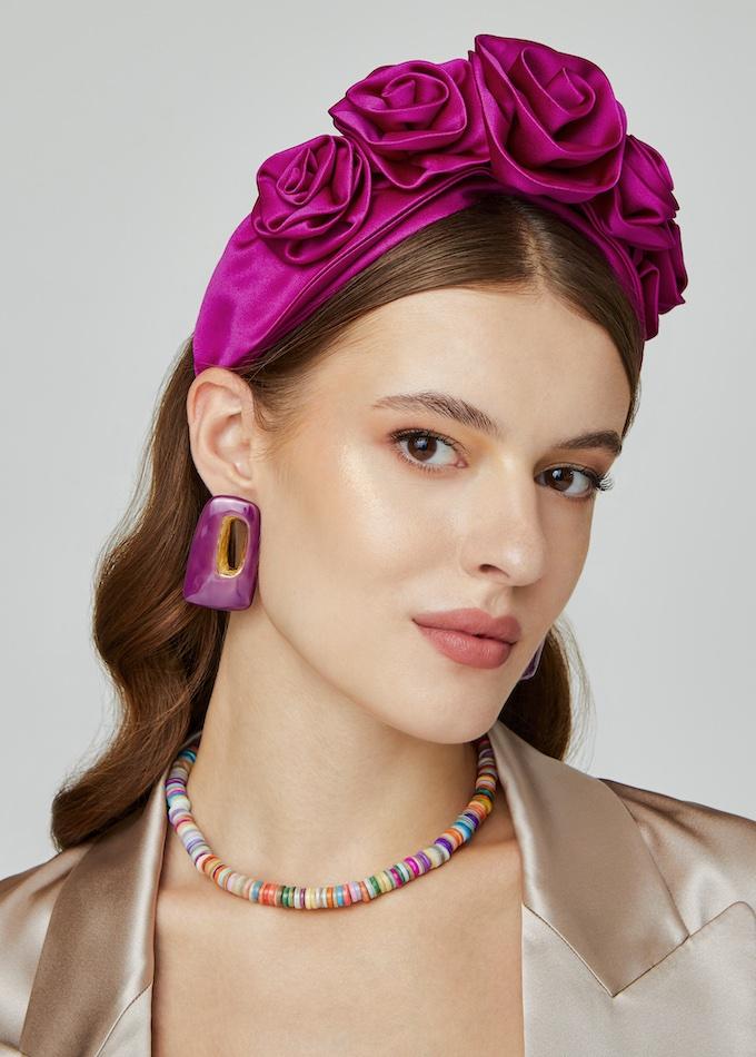 Magenta pink silk rosette headpiece on model