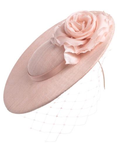 Pale pink disc hat with flower and veil