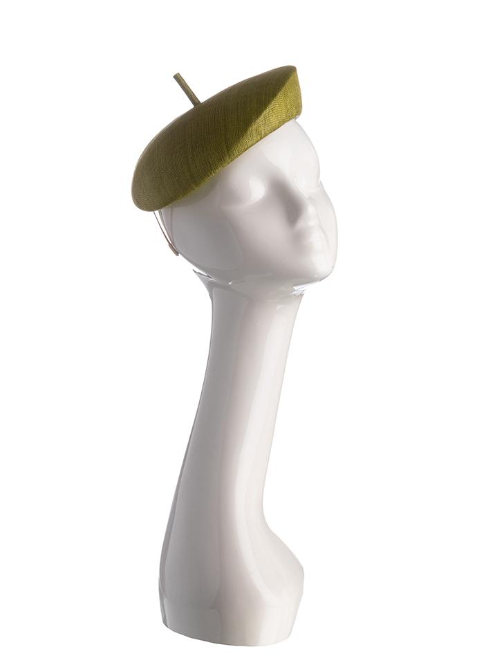 Chartreuse straw beret style pillbox hat with cigarette trim on mannequin