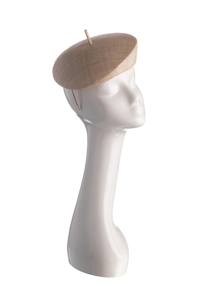 Natural straw beret style pillbox hat with cigarette trim on mannequin