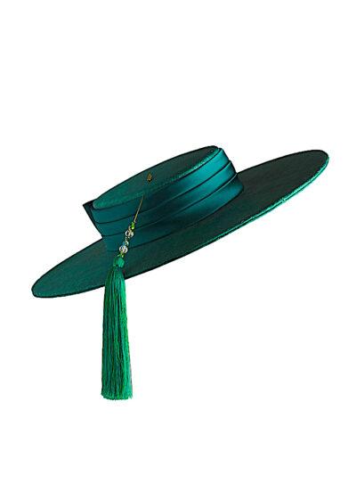 Green straw wide-brimmed boater style hat with silk band and tasselled hat pin