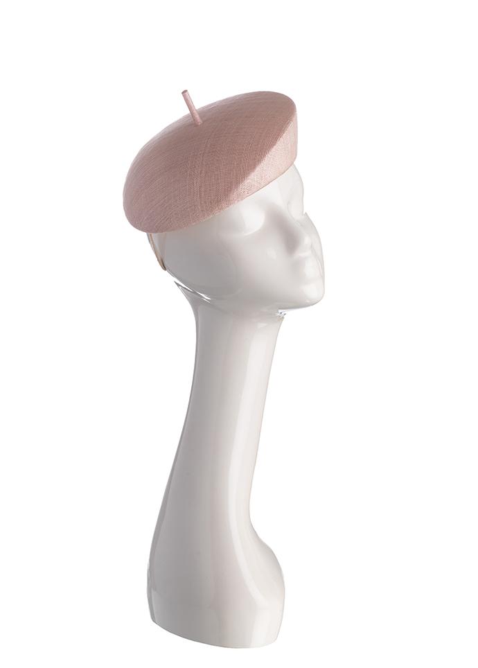 Pale pink straw beret style pillbox hat on mannequin