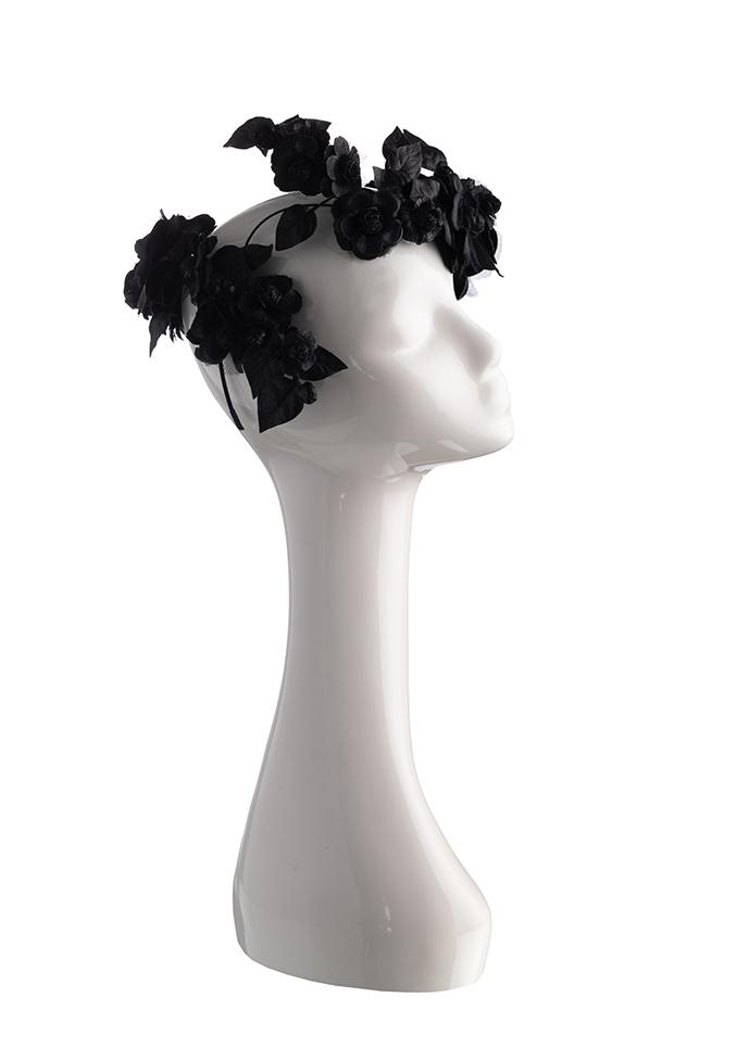 Black leather flower crown headpiece on mannequin