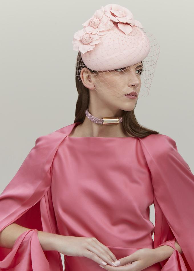 Emily-London pale pink pillbox hat with veil and flowers on model