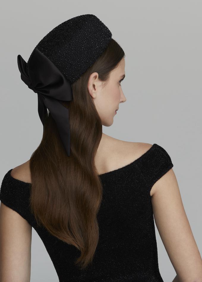 Embellished black Jackie O style Emily-London pillbox hat on model
