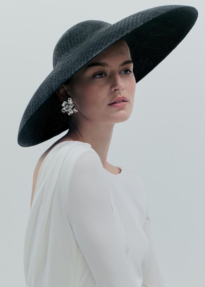 Model image of SS26 black Suzanne straw asymmetric hat