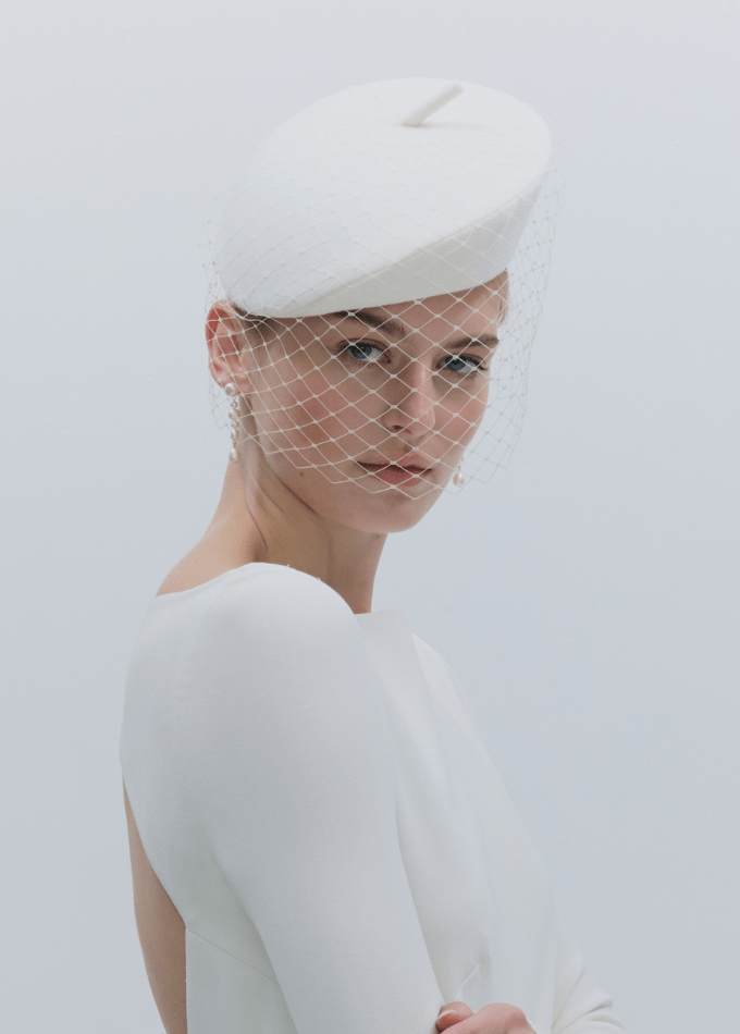 CLOSE-UP Model image wearing white crepe Zellova beret pillbox with birdcage veil