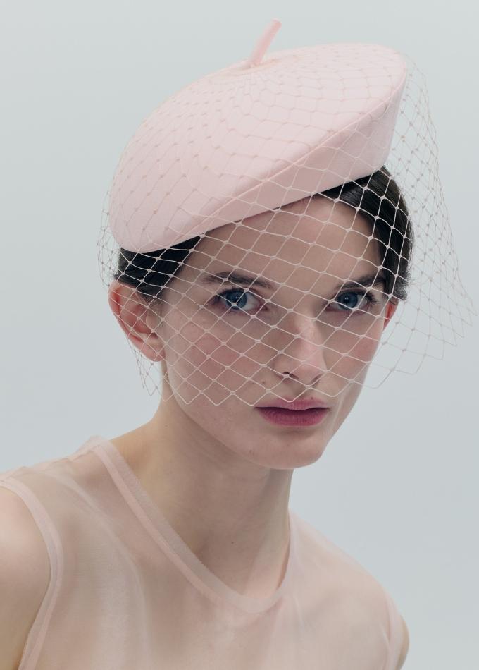 Model image of light pink Zellova beret pillbox hat with birdcage veil