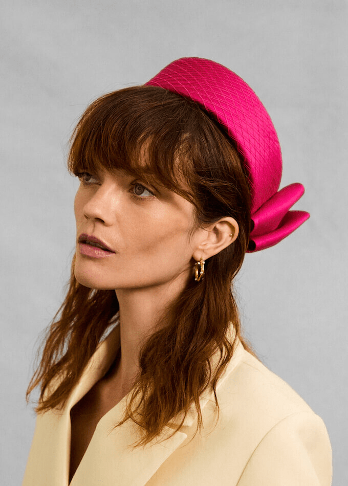 Dark pink silk tailored Aveline pillbox hat with silk bow and veil wrapping