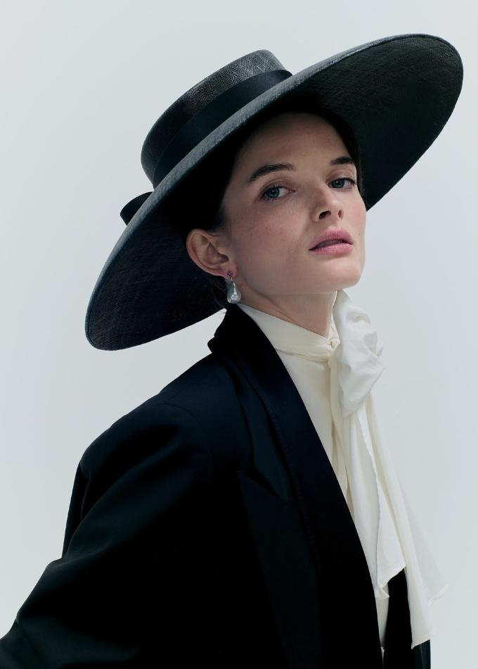 Model image of black Donna straw wide brimmed hat with tailored silk band and double bow