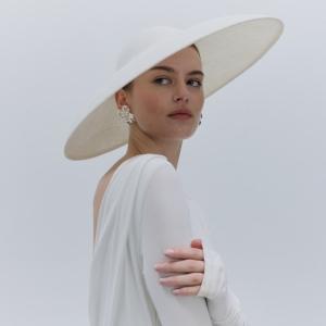 Model image of white asymmetric Suzanne hat